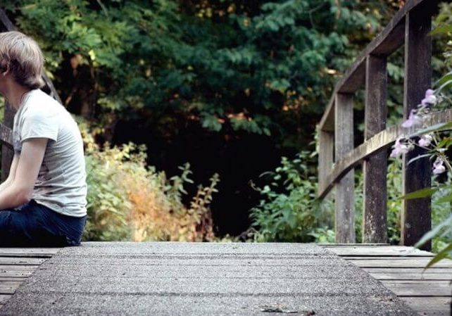 giveITtime_sitting_on_bridge